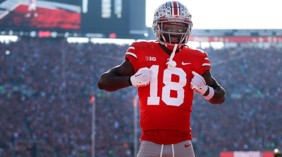 Ohio State wide receiver Marvin Harrison Jr. celebrates a touchdown against Michigan during the first half at Ohio Stadium.